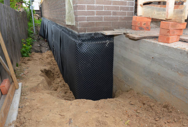 SJ Waterproofing Pros technician performing targeted Vapor Barrier Installation assessment in Martin, MI